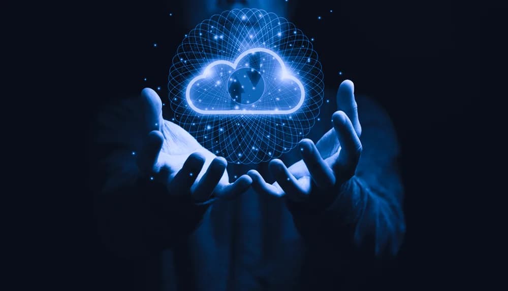 Cupped hands holding a glowing cloud icon connected by lines of light, representing hybrid cloud computing